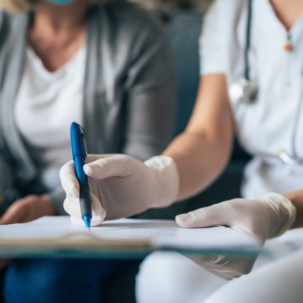 An image of a doctor's visit taking place.