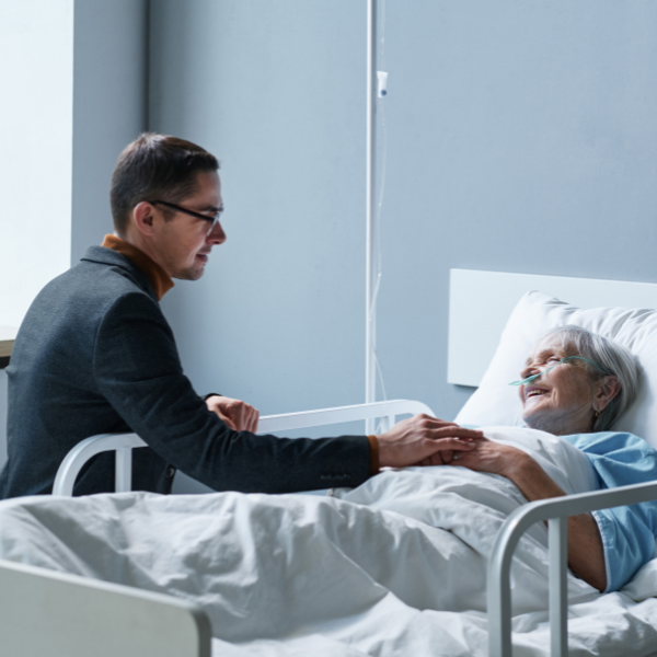 An image of a person visiting a loved one during a hospital stay.